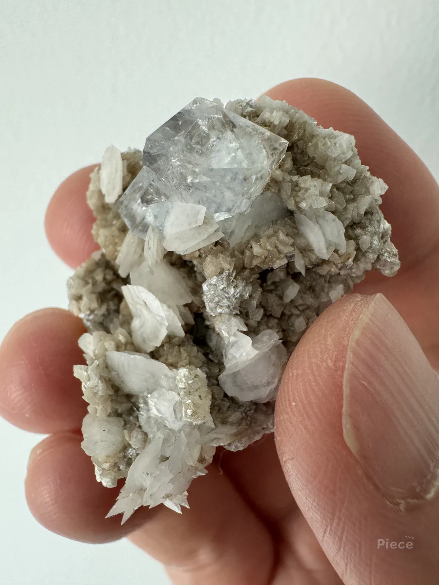 Molybdenite, Muscovite, Fluorite, Calcite